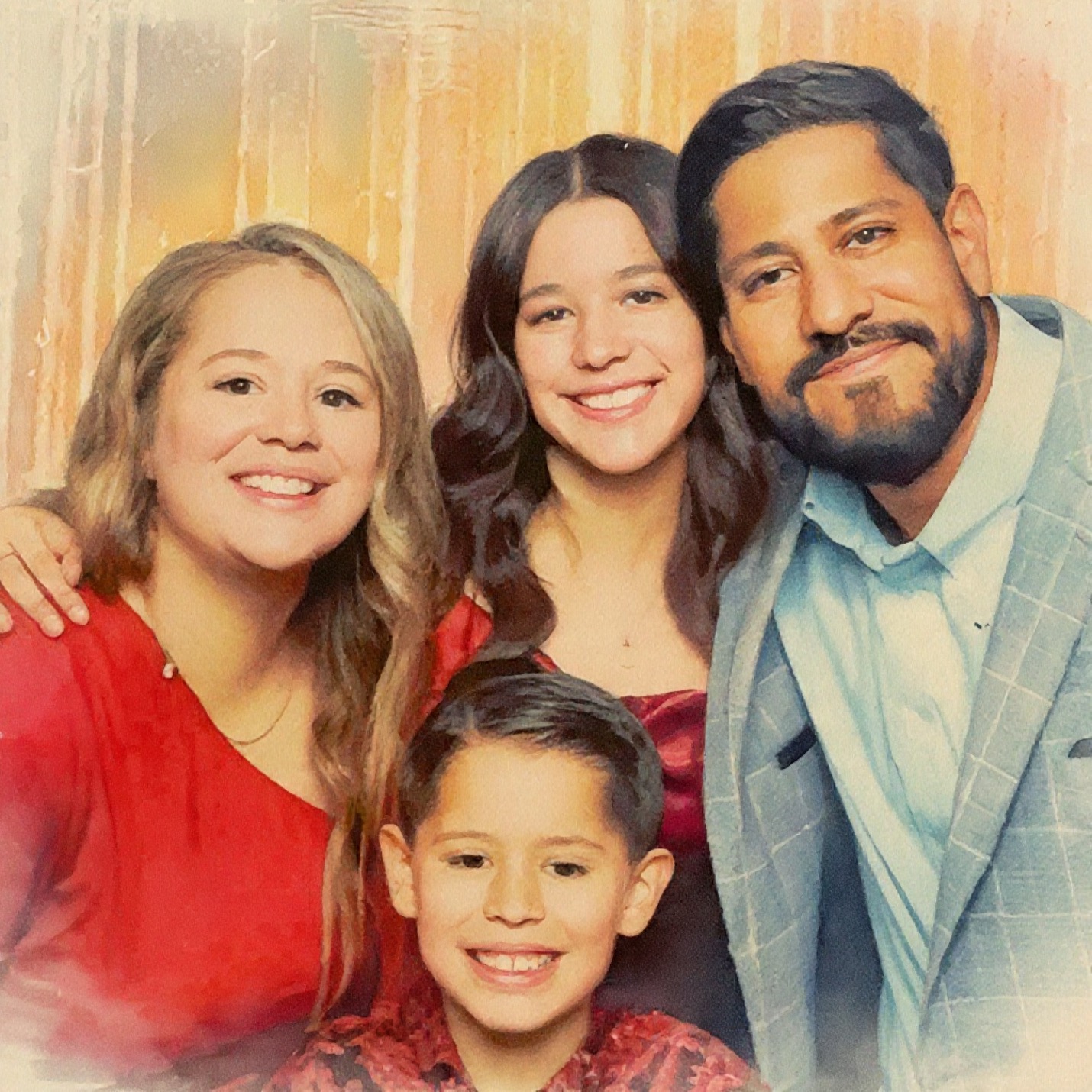 Professional headshot of a smiling man with short black hair and a beard, dressed in a blue blazer and patterned shirt, in a modern interior with decorative elements.