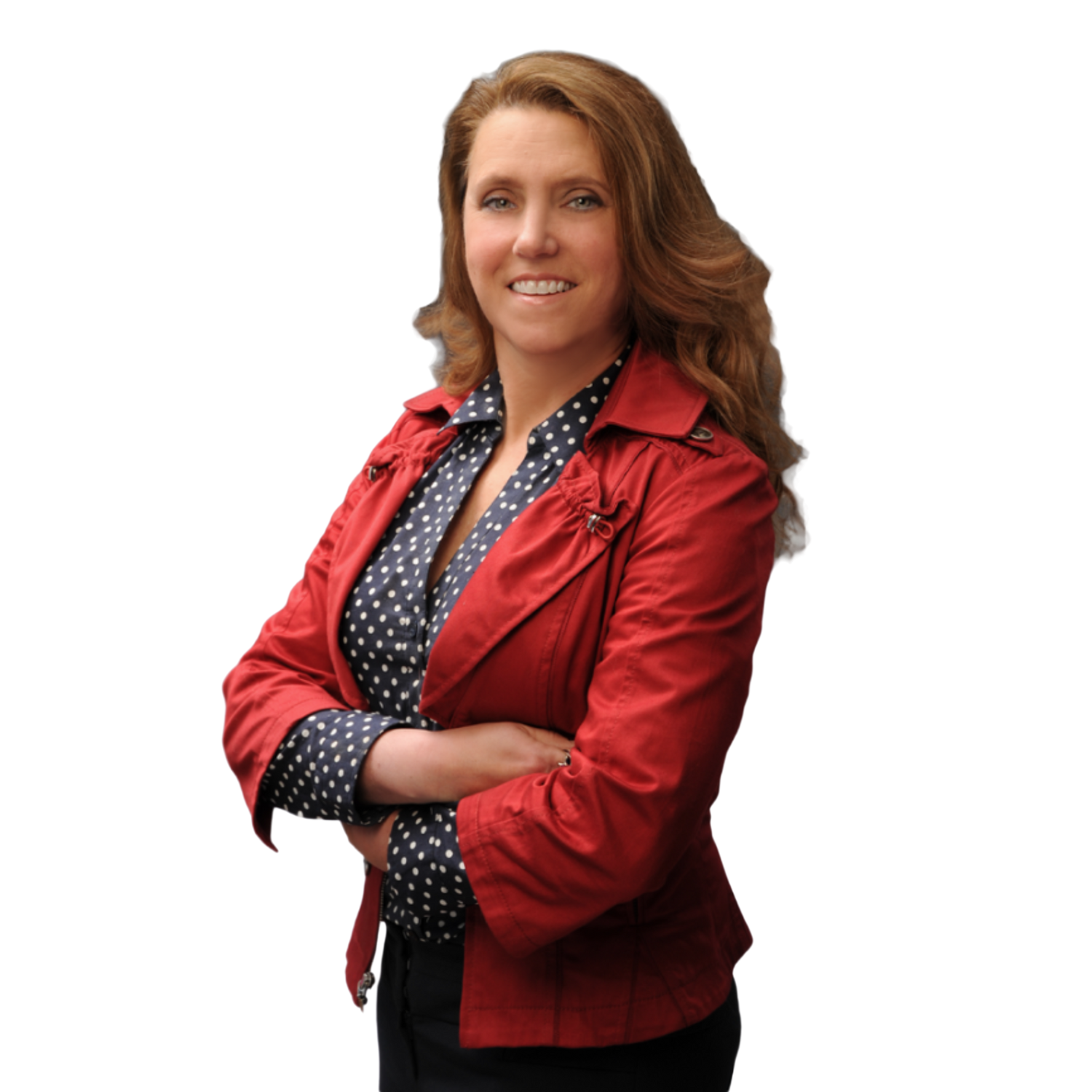 Smiling elderly man with gray hair, glasses, pink shirt, and maroon sweater in a modern office setting.