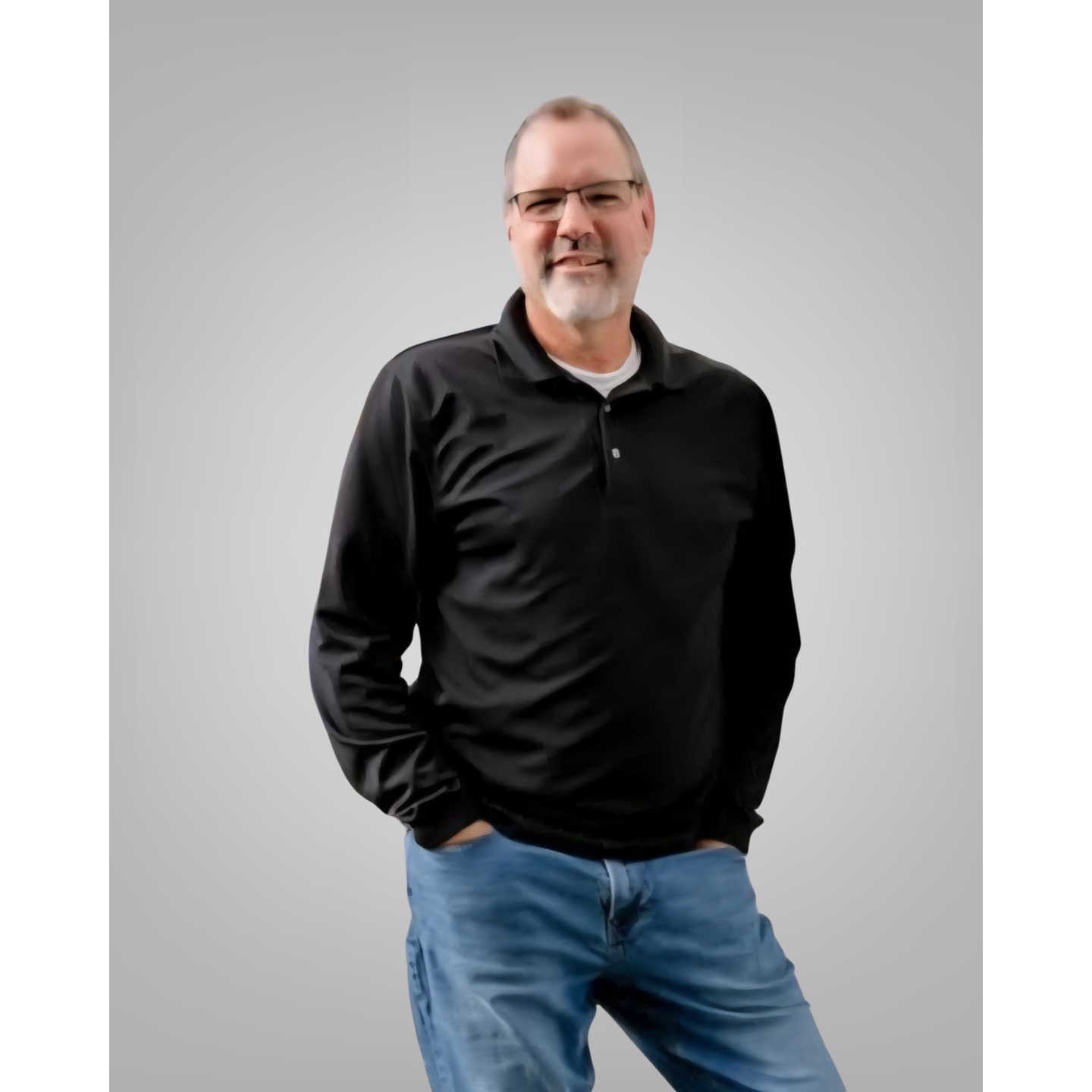 A man in a hat smiling.